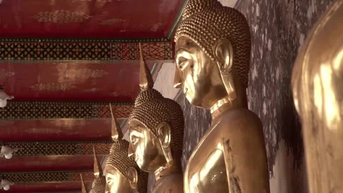 Row of ancient buddha statues in buddhist temple Video stock 347713490