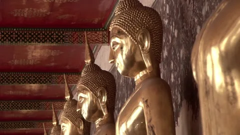 Row of ancient buddha statues in buddhist temple Video stock 347713671