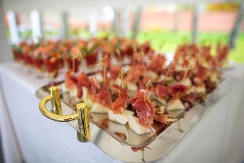 Row of appetizers and starters on the wedding table Stock Photos