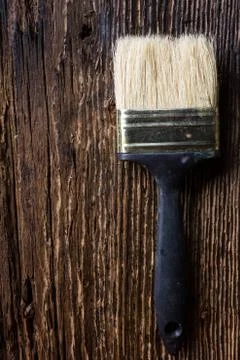 Row of artist paintbrushes close up on old natural rustic grunge Stock Photos