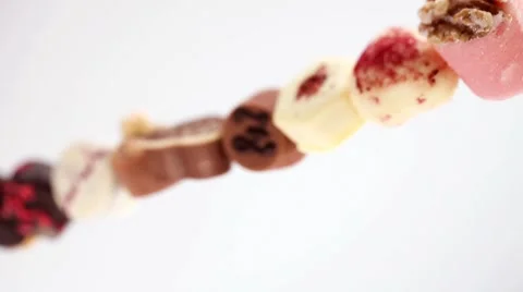 Row of assorted chocolates Stock Footage 8573117