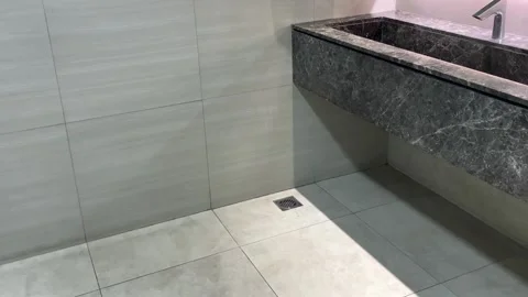 A row of automatic faucets in a luxurious bathroom with a marble sink. Stock Footage 320504523