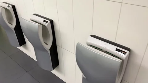 Row of automatic sensory hand dryers on ... | Stock Video | Pond5