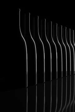 Row of backlit bottles on black background. 3d illustration. Illustrazione stock