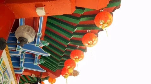 A row of backlit red lantern with lens flare created by camera movements Stock Footage 101932594