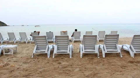 Row of beach chairs at Koh Samet Rayong Thailand Stock Footage 49795918