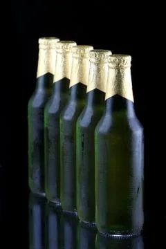 Row of Beer Bottles Stock Photos