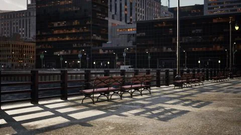 A row of benches sitting next to each other near tall buildings Ilustração Stock