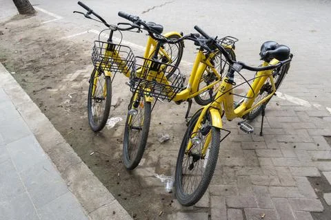 Row of bicycles with baskets on the front Stock Photos