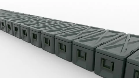 A row of black plastic tool storage boxes move slowly across the diagonal of the Stock Footage 160315657