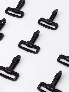 Row of black zipper pull sliders variant Stock Photos