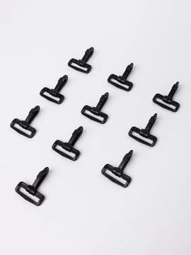 Row of black zipper pull sliders Stock Photos