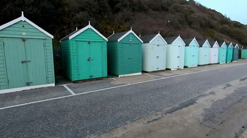 Row of blue beach huts on the coast of Bournemouth, UK Stock Footage 200887458