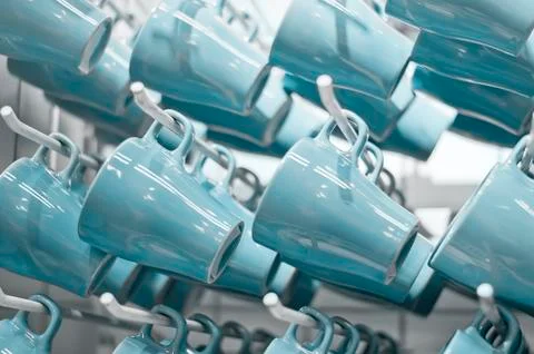 Row of blue cups on display Stock Photos