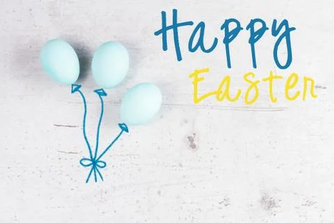 Row of blue eggs with daffodil Stock Photos