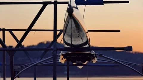 Row boat at sunrise on rack Video stock 280370211