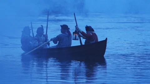 Row boats crossing a foggy river at nigh Stock Video Pond5