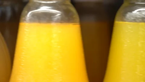 A row of bottles with juice in the store Stock Footage 156780837