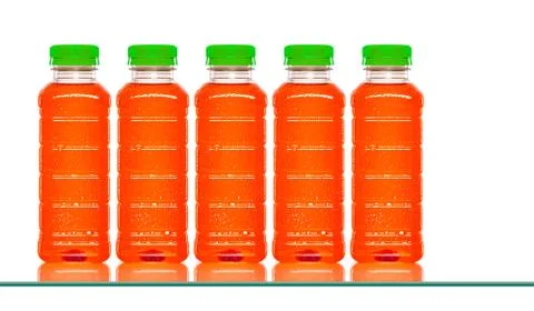 Row of bottles with orange beverage Stock Photos