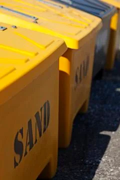 A row of boxes filled with sand for de-icing in winter Stock Photos