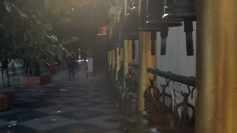 Row of Bronze Temple Bells at a Serene Thai Buddhist Temple Stock-Footage 333705571