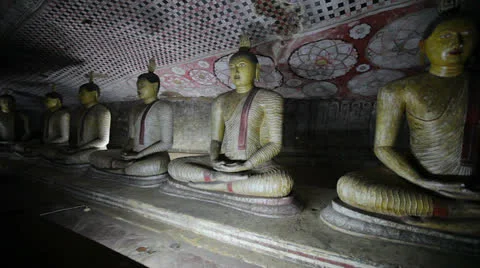 Row of buddha statues in the ancient cave temple. sri lanka, dambulla Stock Footage 23441896