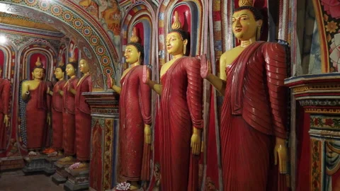 Row of buddha statues inside dambulla cave temple in sri lanka Stock Footage 340641279
