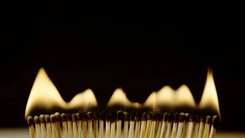 Row of burning matches, Ultra Slow Motion Video stock 86576965