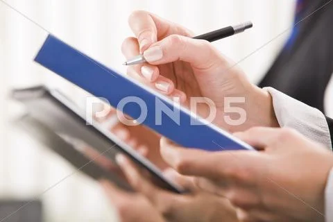 Row of business peoples hands at conference Stock Photos