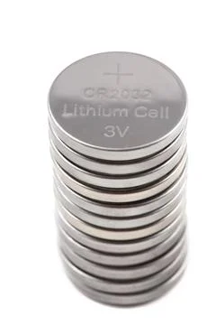 A row of button batteries Stock Photos