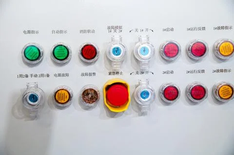 A row of buttons with a red one in the middle Stock Photos