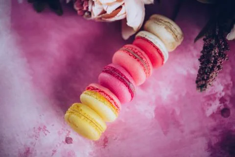 Row of cake macaroons on bright background. Close up macaron dessert on top view Fotos Stock