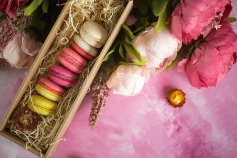 Row of cake macaroons in gift box on bright background. Copyspace for text and Stock Photos