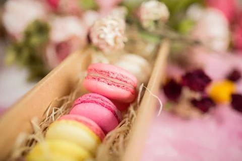 Row of cake macaroons in gift box on bright background. Copyspace for text and Stock Photos