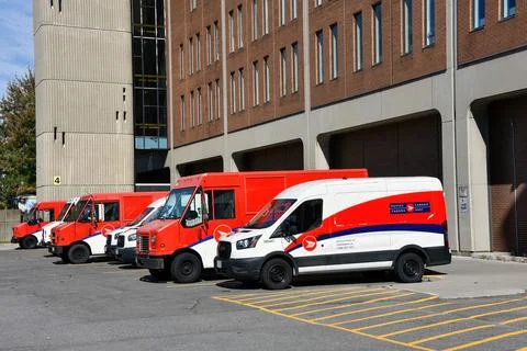 Row of Canada Post trucks idle due to strike Stock Photos