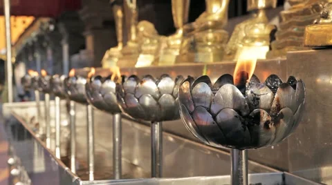 Row of candles burning in a Buddhist Temple in Chiang Mai, Thailand Stock Footage 49726726