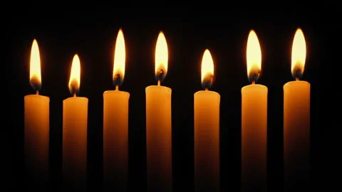 Row Of Candles Burning In The Dark Stock Footage 130540544