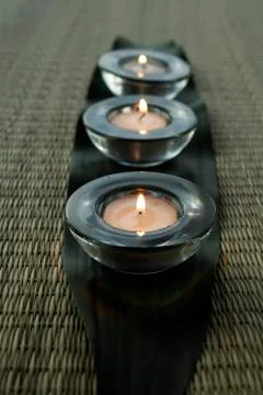 Row of candles on a leaf Stock Photos