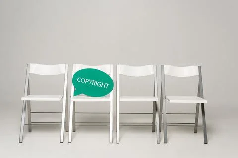 Row chairs thought bubble copyright Stock Photos