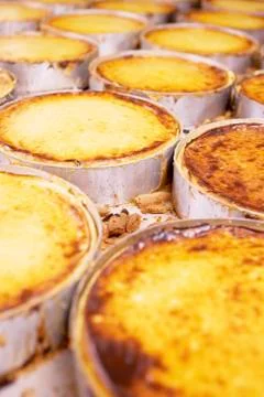 A row of cheesecakes in a bakery Stock Photos