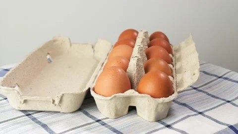 Row of chicken eggs and one egg open. Cooking food, healthy food Video stock 202748958