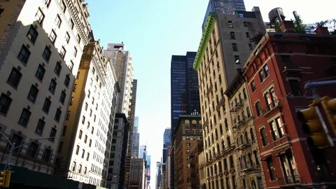 Row of classical skyscrapers in NYC New York City Manhattan street drone shot Stock Footage