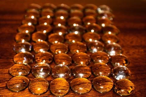 Row of Clear Marbles Sprayed with Water Stock Photos