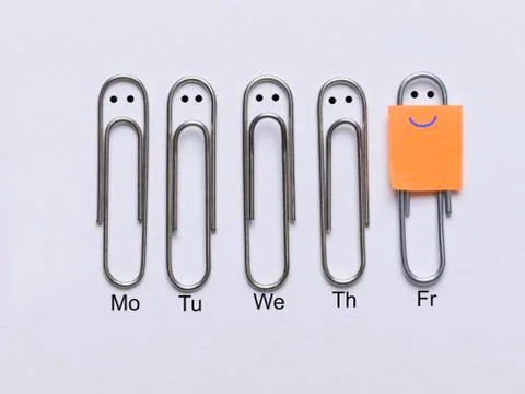 Row of clips appearing sad faces except the corresponding clip smiley face Stock Photos
