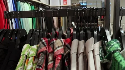 A row of clothes on hangers in the store Stock Footage 208115983