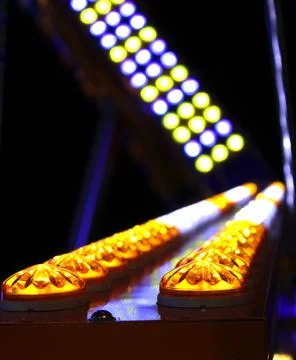 Row of colored light bulbs at a luna park. Stock Photos