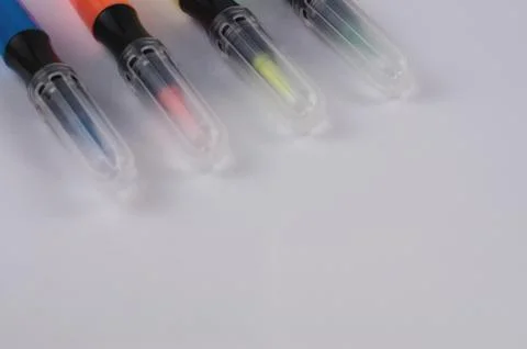 Row of colored marker brushes with transparent plastic tip Stock Photos