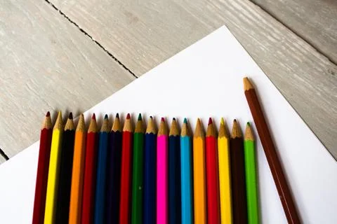 A row of colored pencils folded Stock Photos