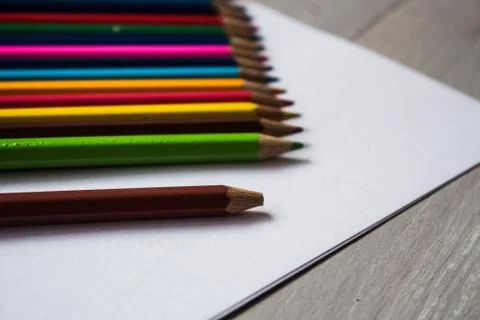 A row of colored pencils folded Stock Photos
