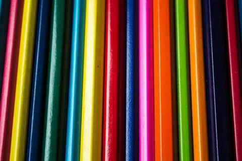 Row of colored pencils folded Stock Photos